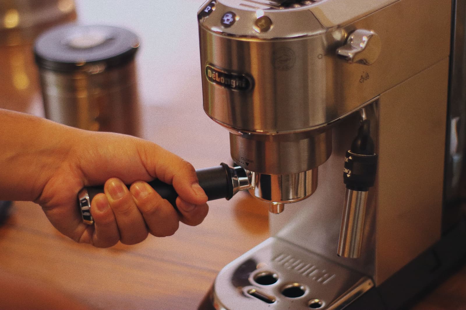A stainless espresso machine on a home kitchen counter