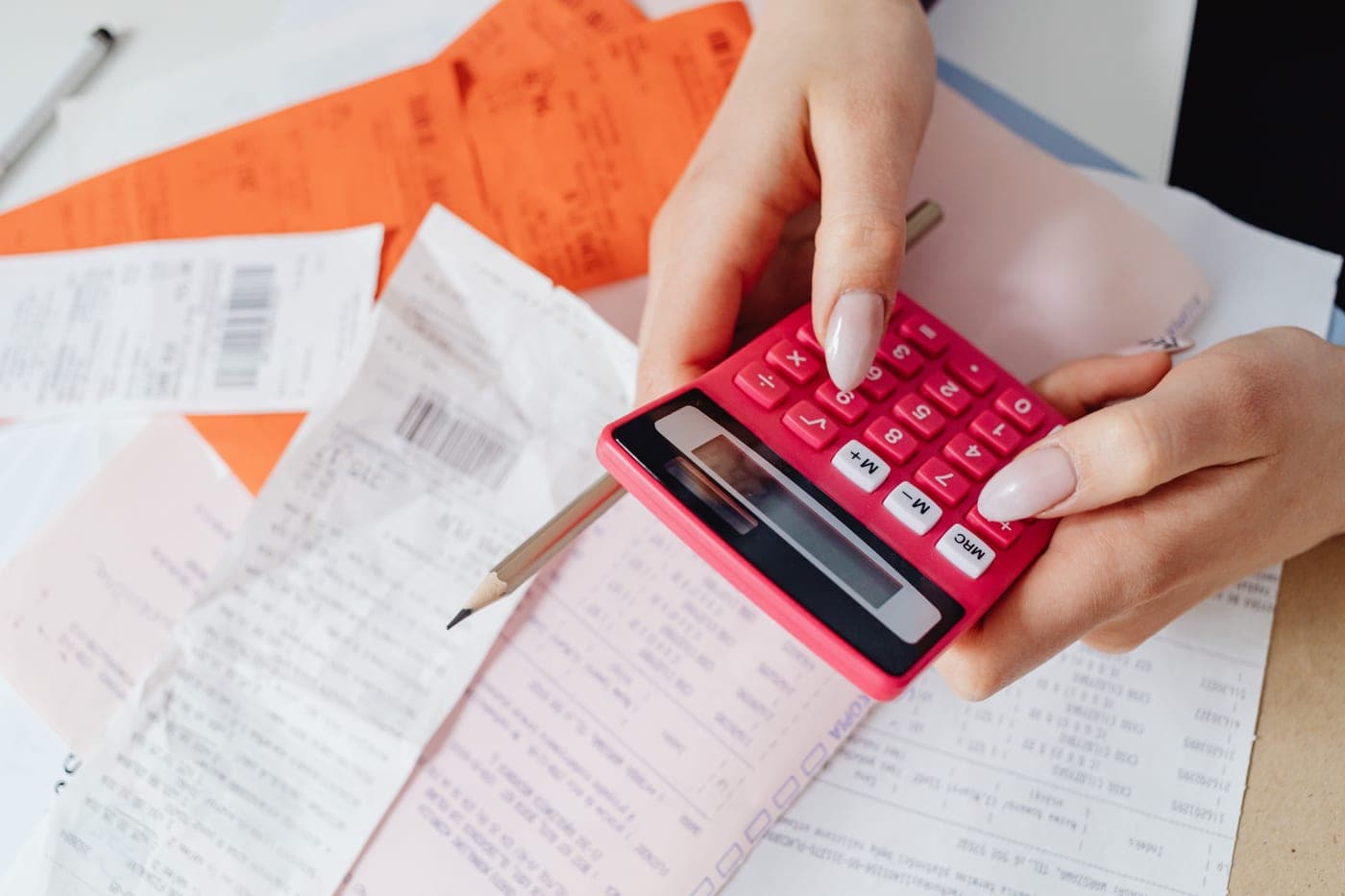 A calculator and receipts on a table
